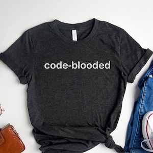 May include A heather dark gray t shirt with the t