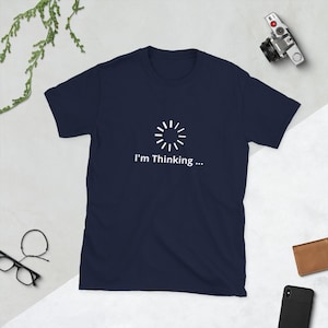 May include A navy blue t shirt with a white loadi