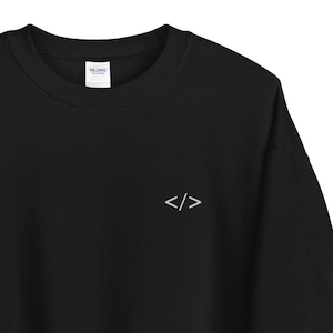 May include Black crew neck sweatshirt with a smal