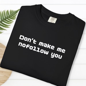 May include Black t shirt with the text Dont make 