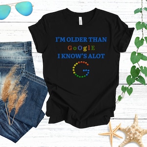 May include Black t shirt with the text Im older t