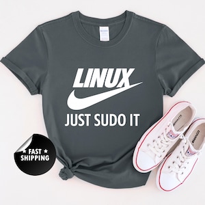 May include Dark gray t shirt with the text LINUX 
