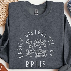 May include Dark heather grey sweatshirt with a wh