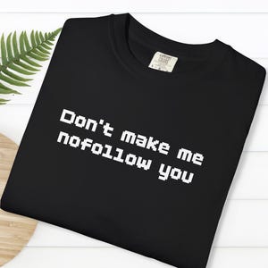 May include Black t shirt with the text Dont make 