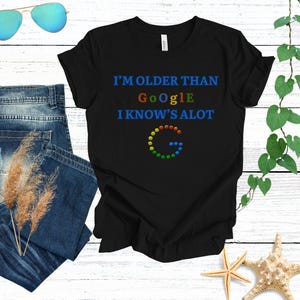 May include Black t shirt with the text Im older t